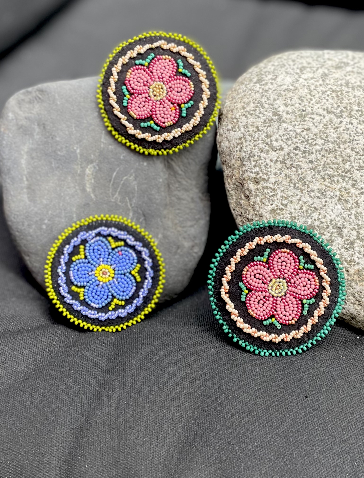 Three beaded Métis rose pins